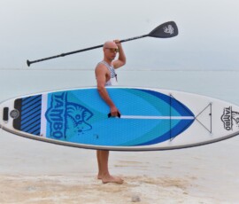 Guy standing on a beach of the dead sea