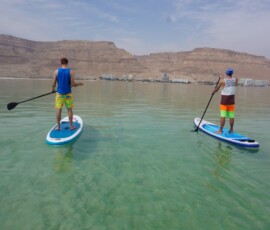 Two beach boys on paddleboards