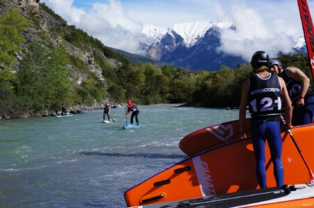 SUP racers on Durance River under the Alps