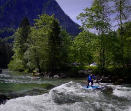Overcoming technical parts of a river on a Stand Up Paddle