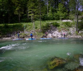 Crystal clear Alp river and Stand Up Paddleboarding