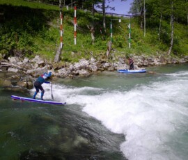 Guy overcoming drop on Stand Up Paddle