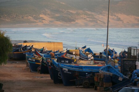 Blue boats on beach in Tafedna