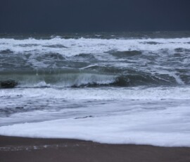 Waves and dark skies